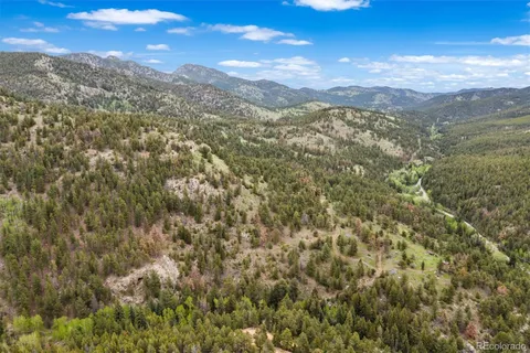 a view of a mountain from a yard