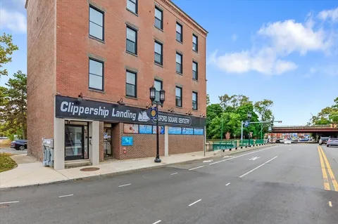 a view of a building with a street