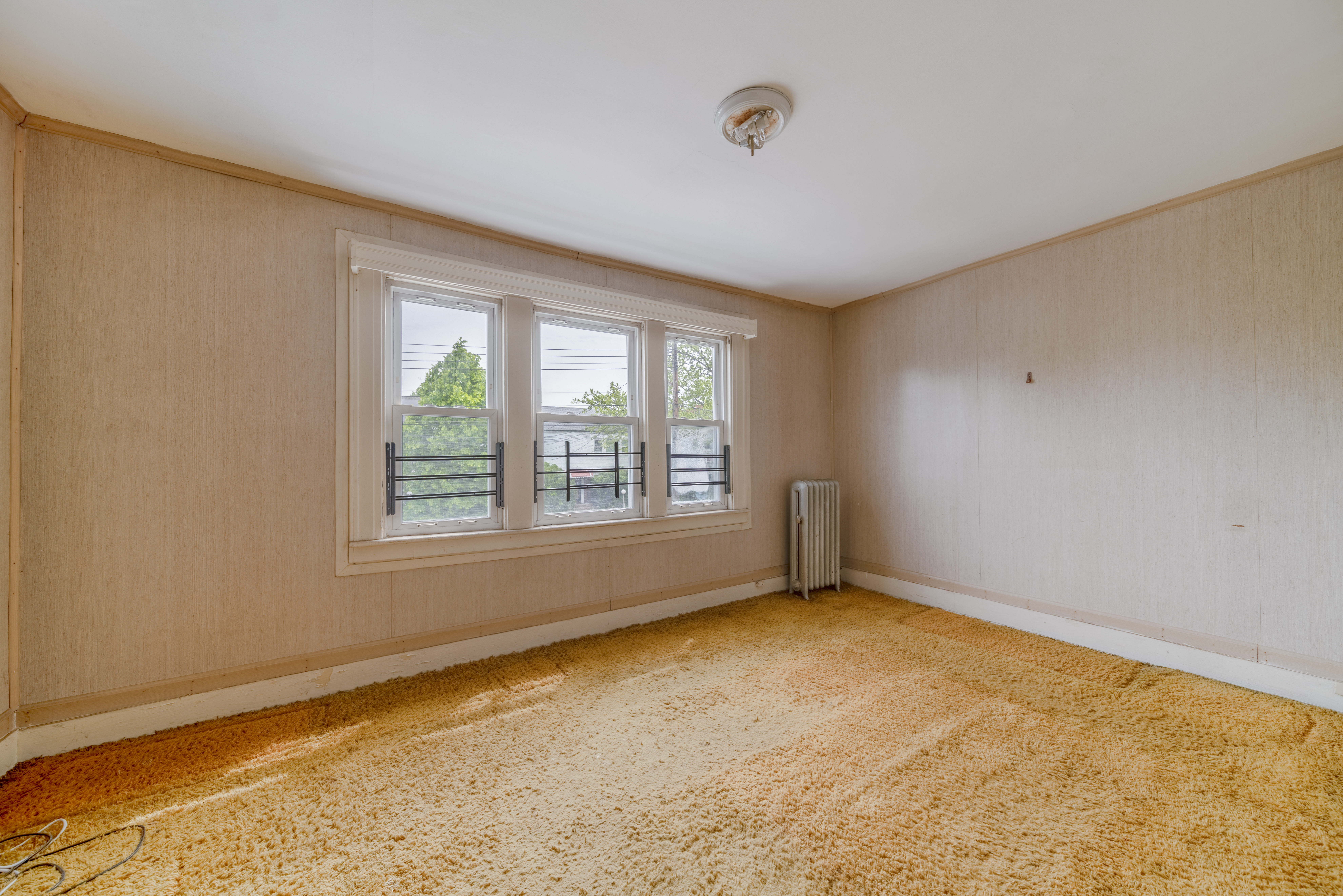 100-30 198th Street Queens, NY 11423 - Photo 12 of 15 a view of an empty room with a window