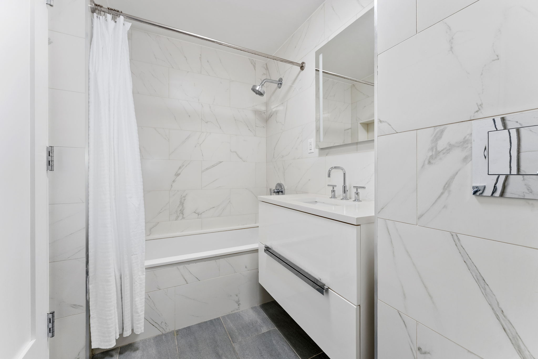 175 West 95th Street, Unit 15D Manhattan, NY 10025 - Photo 9 of 13 a bathroom with a sink and shower
