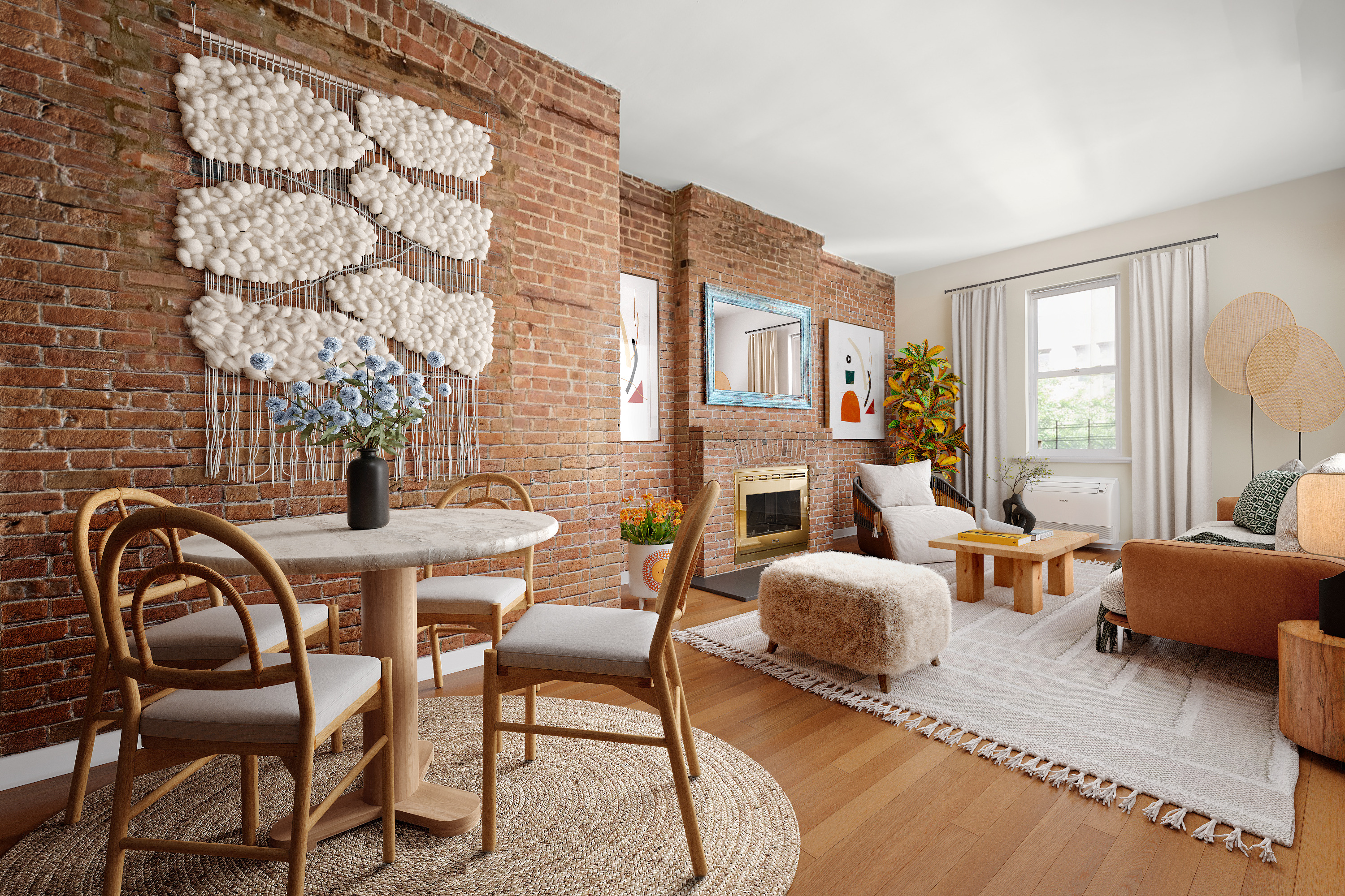 a living room with furniture a fireplace and large windows