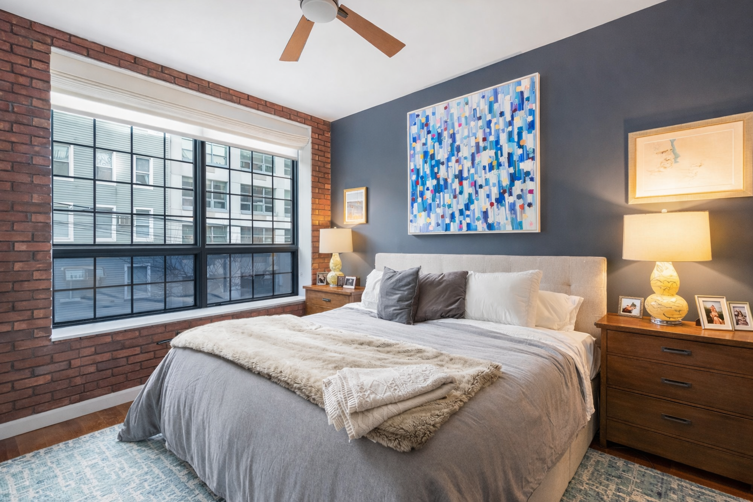 5-25 47th Road, Unit 2A Queens, NY 11101 - Photo 5 of 17 a bedroom with a large bed and a window