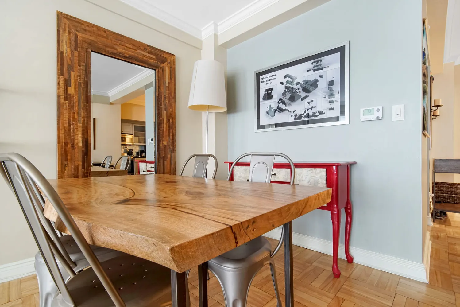 a dining room with table and chairs