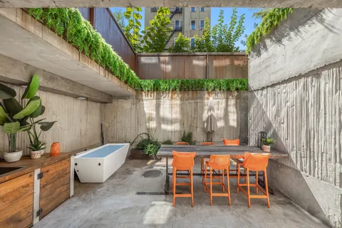 an outdoor sitting area with furniture