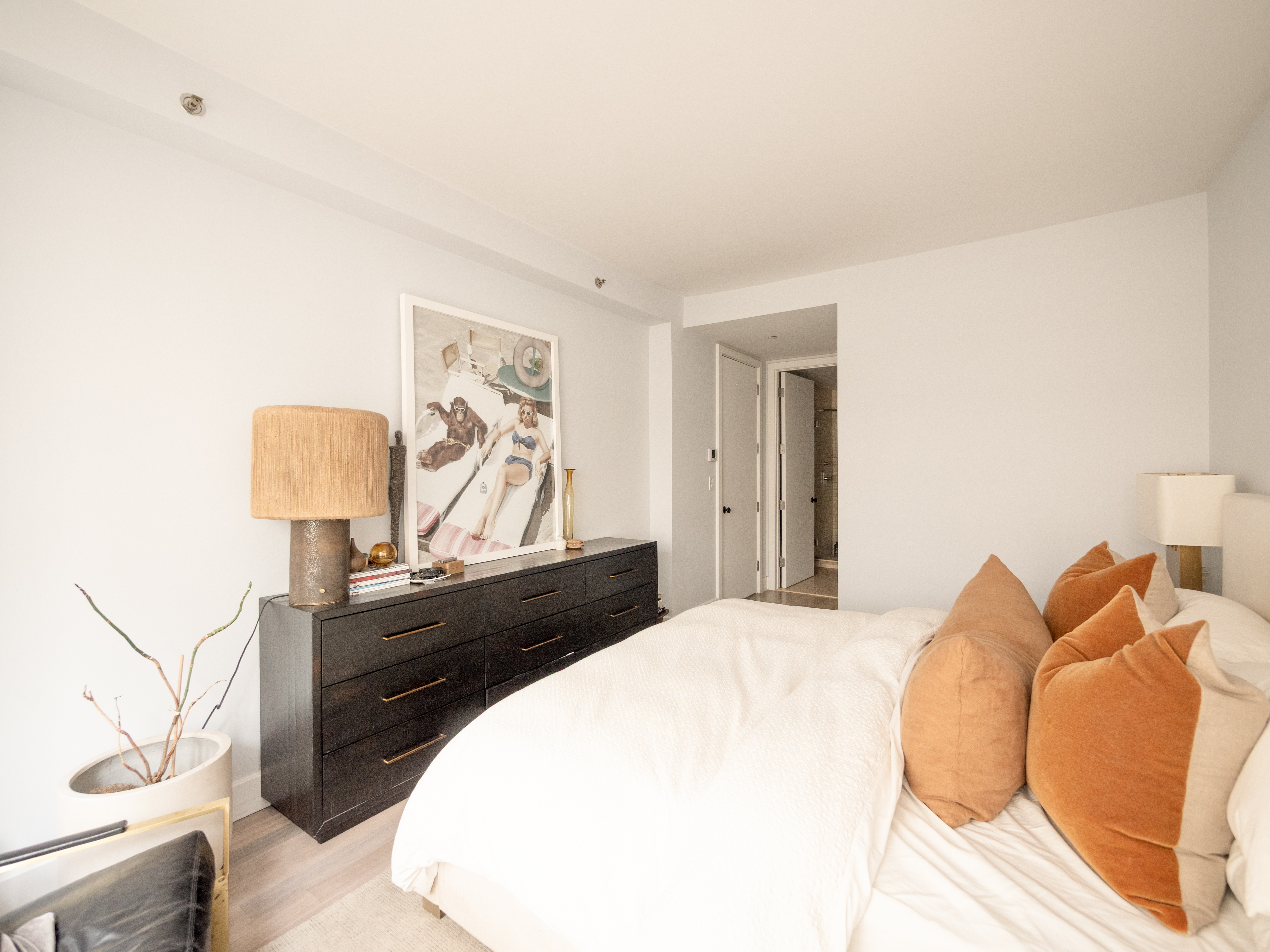 84 Front Street, Unit 5E Brooklyn, NY 11201 - Photo 5 of 11 a bedroom with a bed and a lamp on dresser