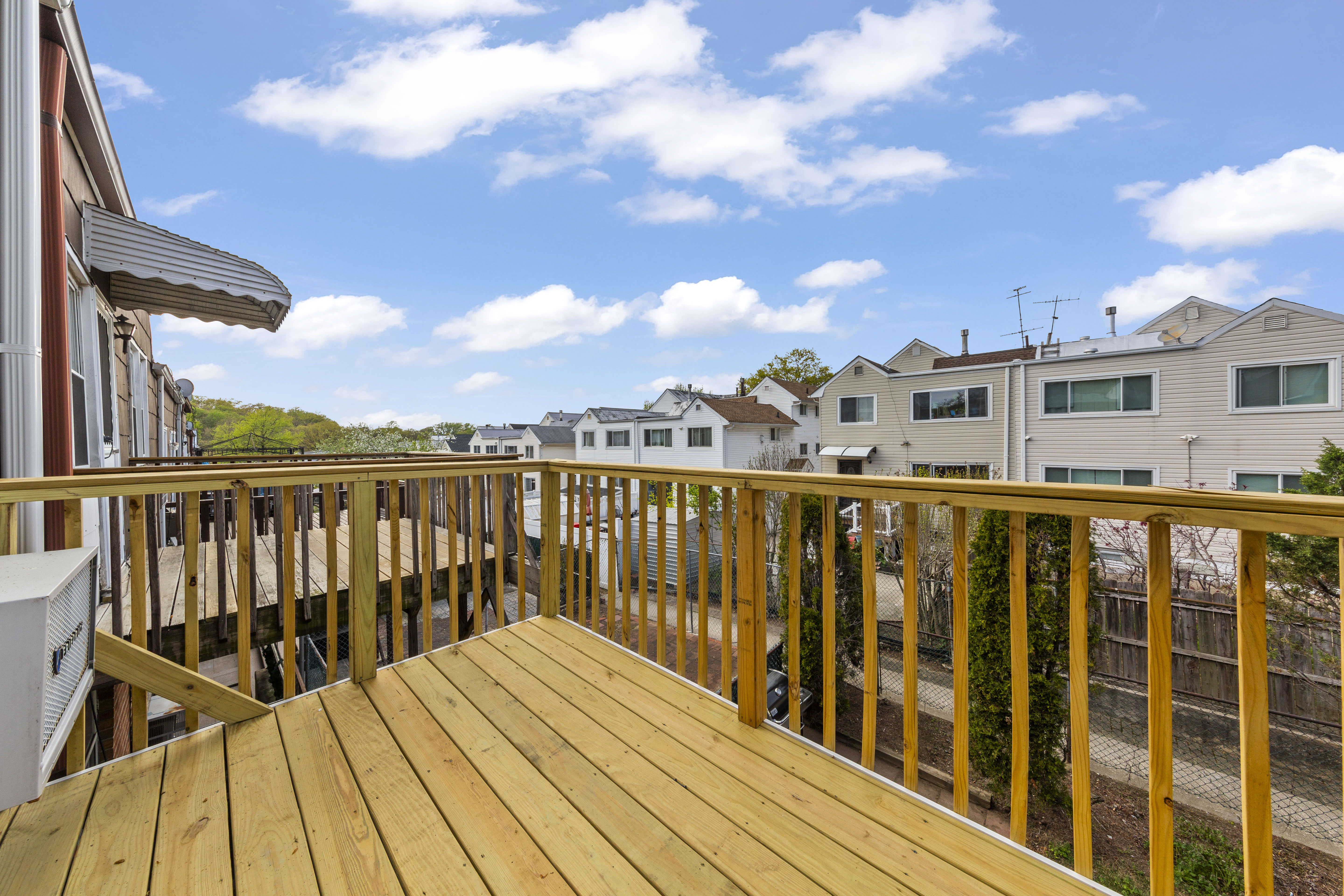 240-47 68th Avenue Queens, NY 11362 - Photo 34 of 39 a balcony with wooden floor