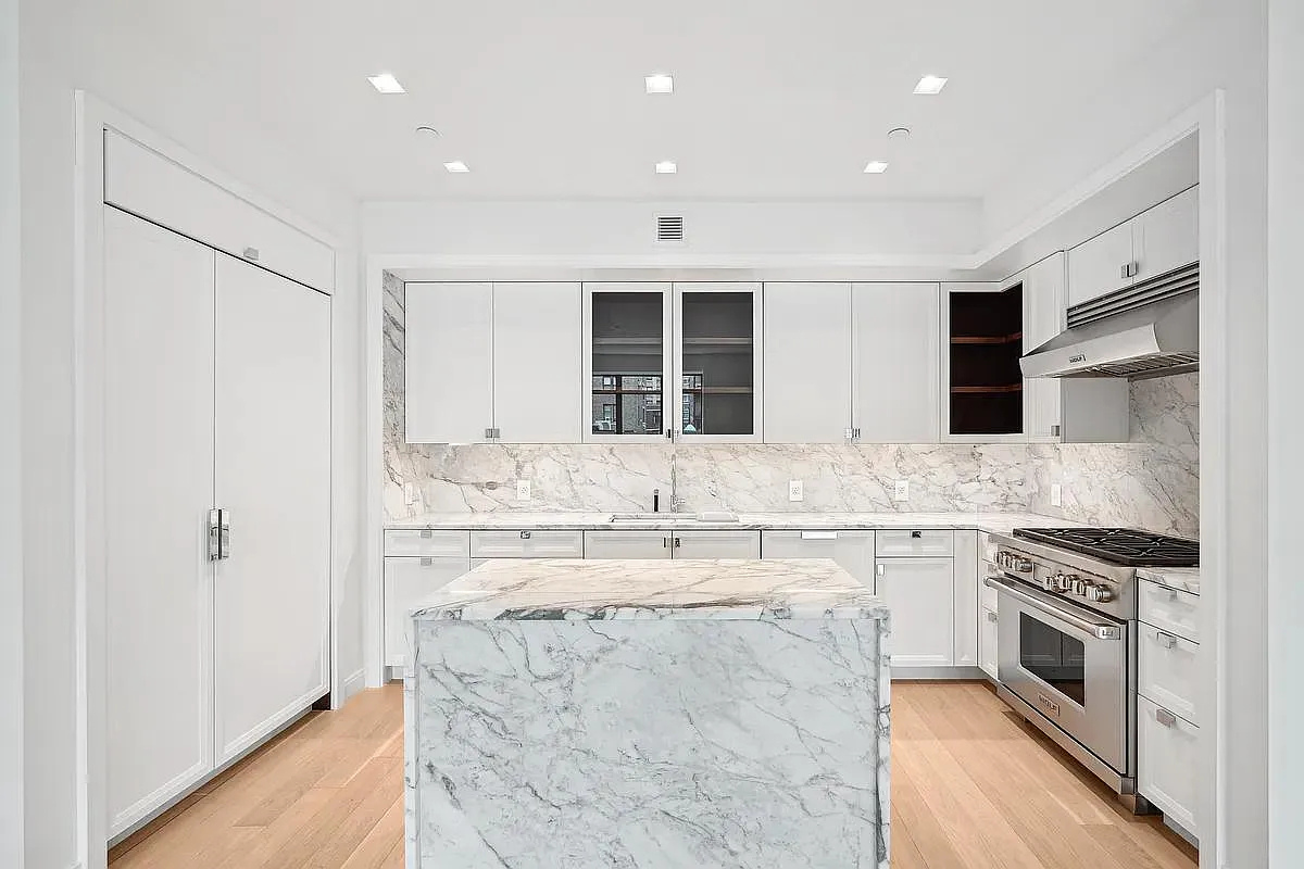 269 West 87th Street, Unit 9B Manhattan, NY 10024 - Photo 4 of 23 a large kitchen with stainless steel appliances granite countertop a stove and a sink