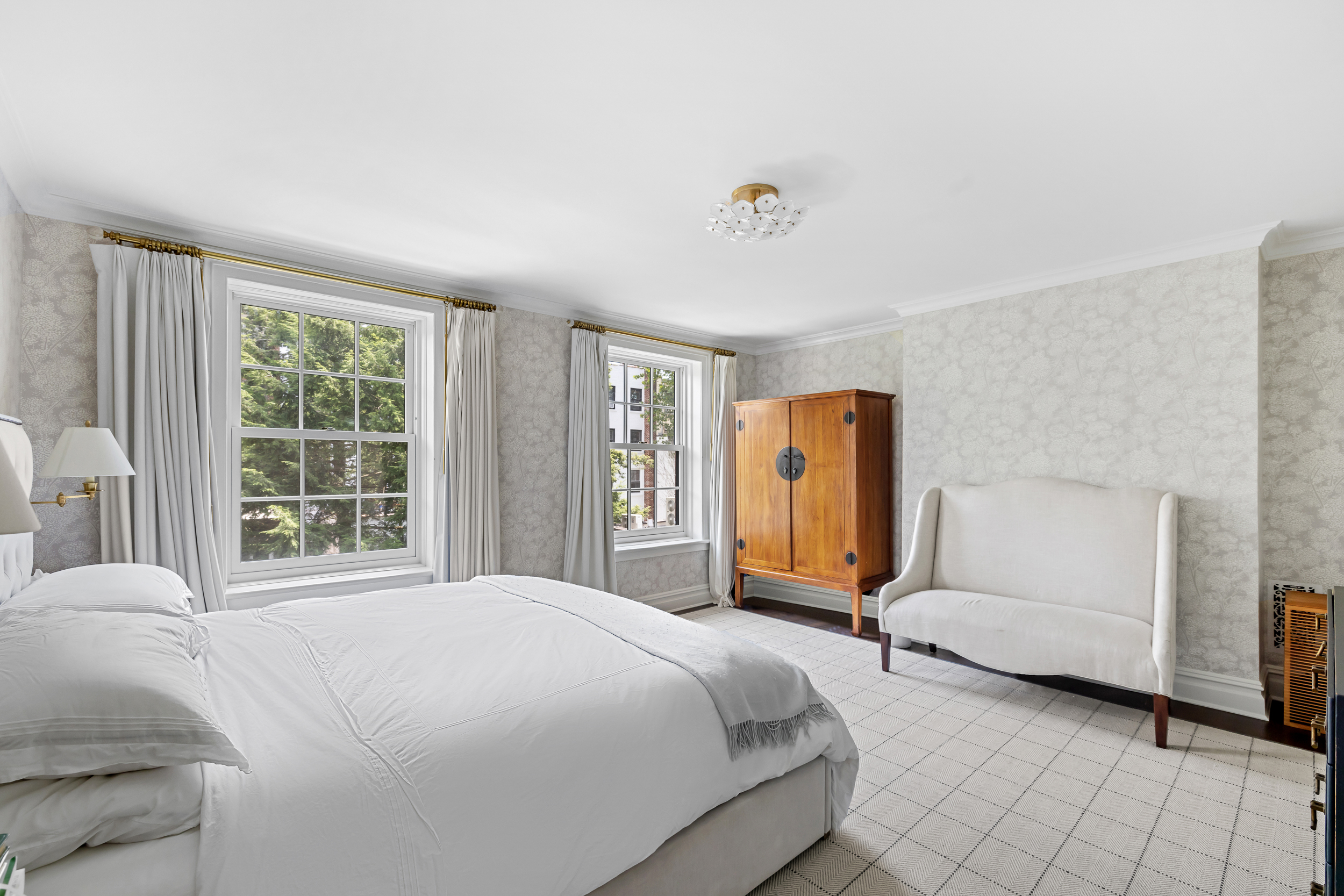 13 Garden Place, Unit B Brooklyn, NY 11201 - Photo 7 of 22 a bedroom with a bed and dresser with mirror