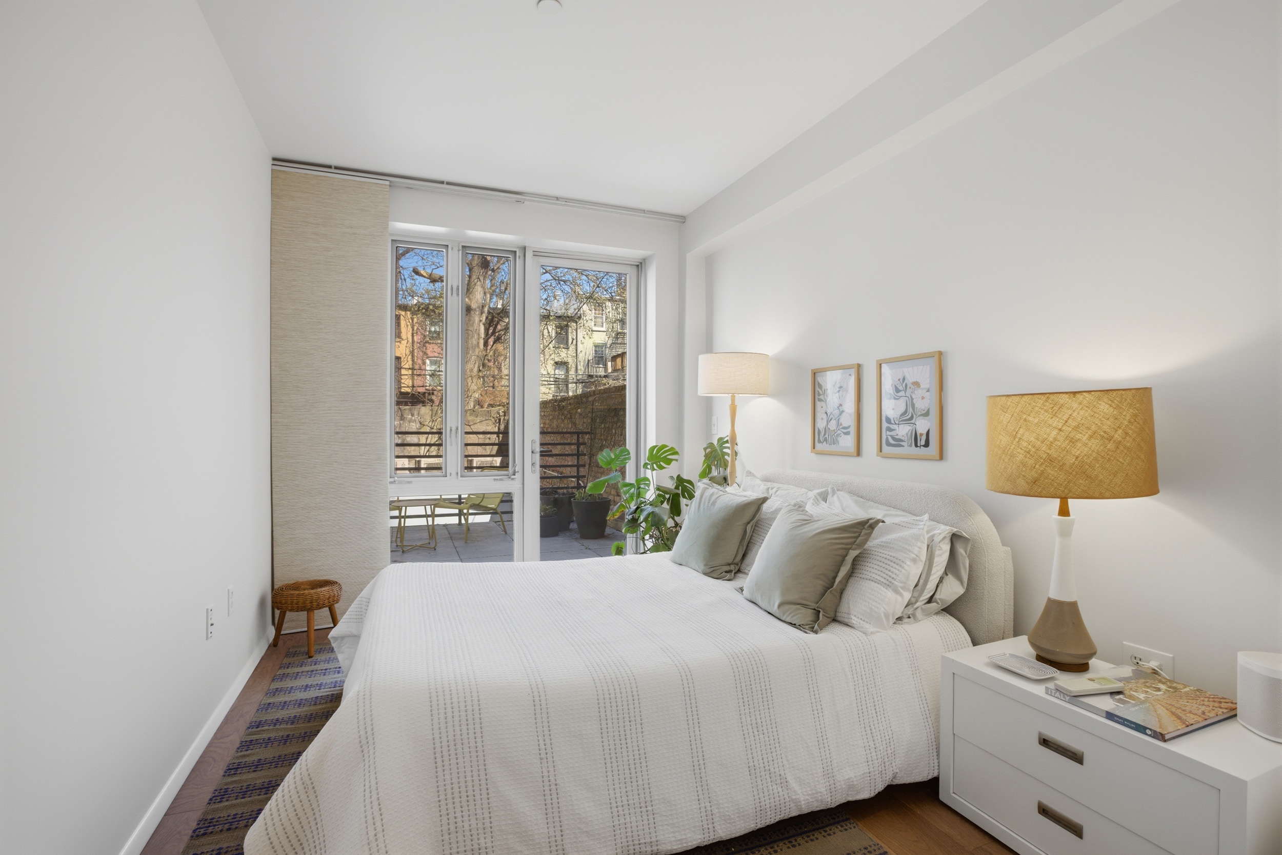 433 Warren Street, Unit 2C Brooklyn, NY 11217 - Photo 7 of 19 a bedroom with a bed and a night stand