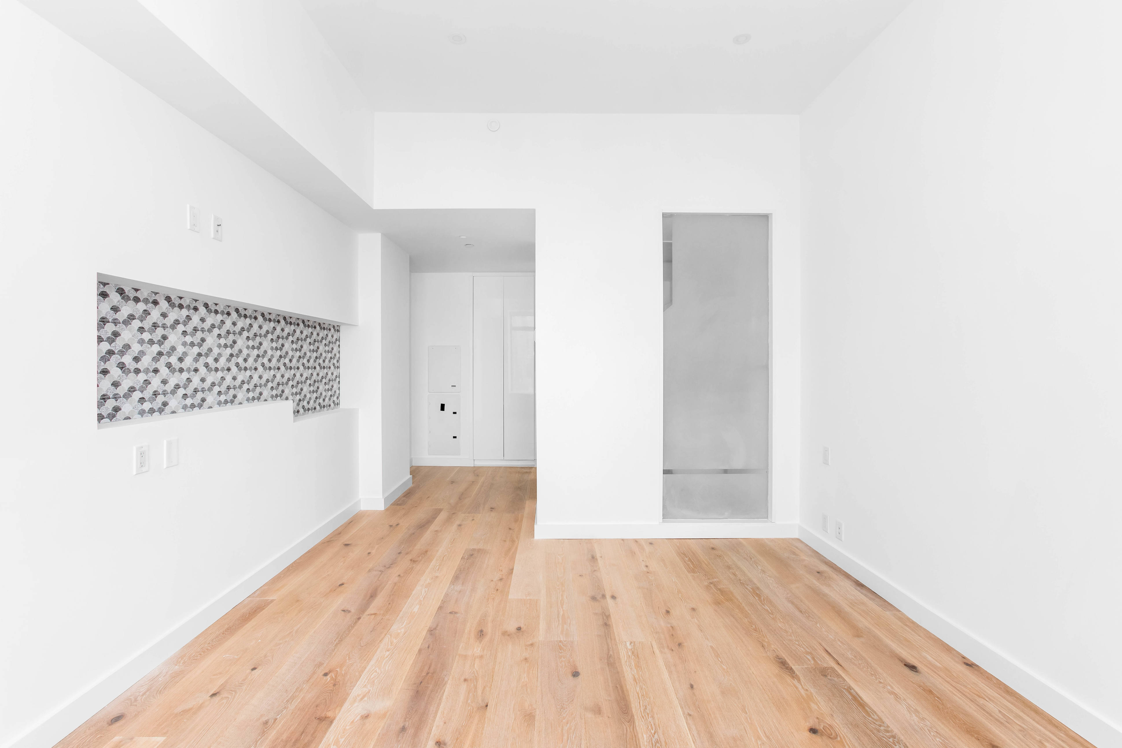 123 Washington Street, Unit 30F Manhattan, NY 10006 - Photo 3 of 8 a view of an empty room