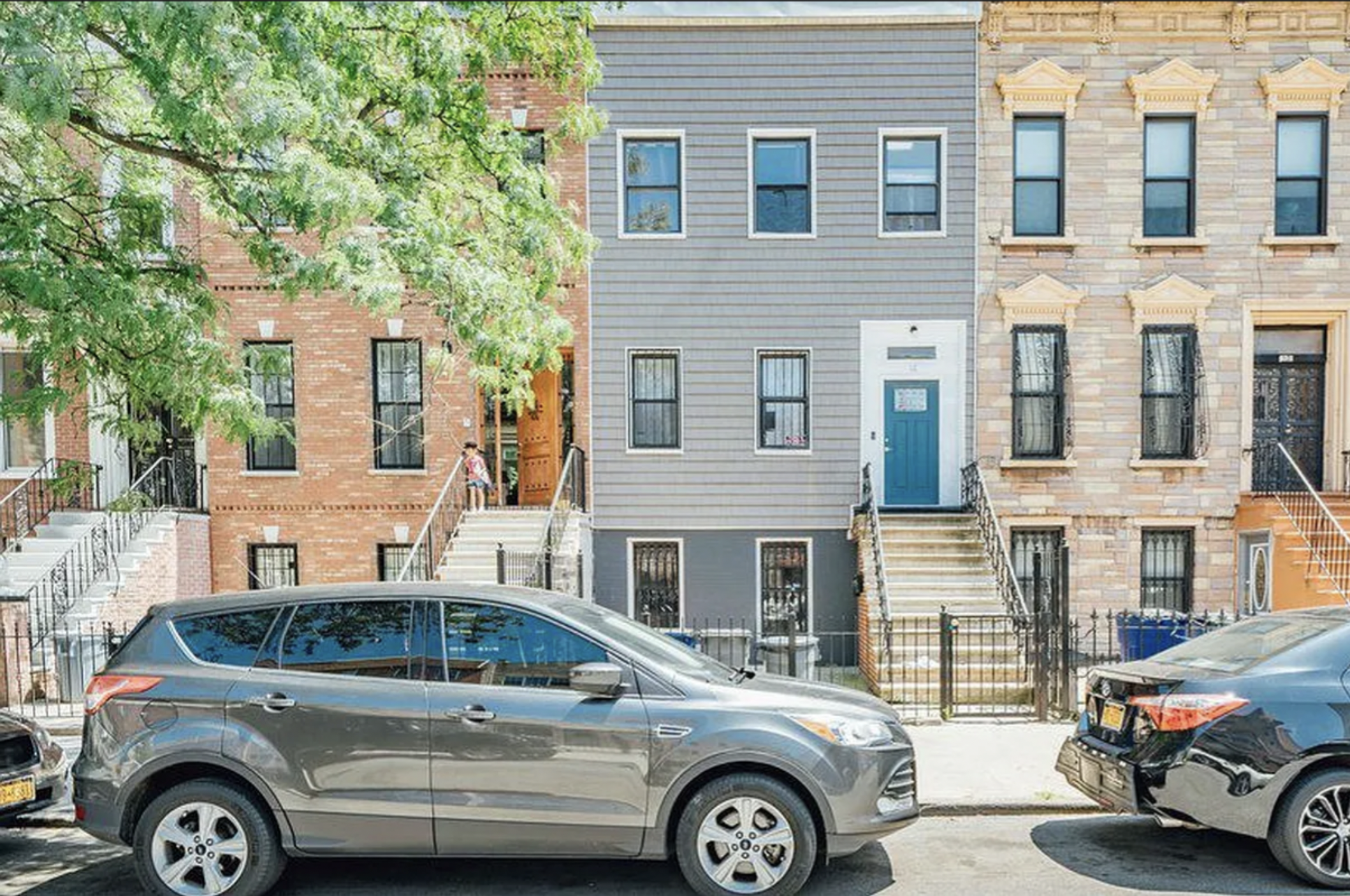 14 Covert Street, Unit 1 Brooklyn, NY 11207 - Photo 8 of 9 a front view of a residential apartment building with a parking space