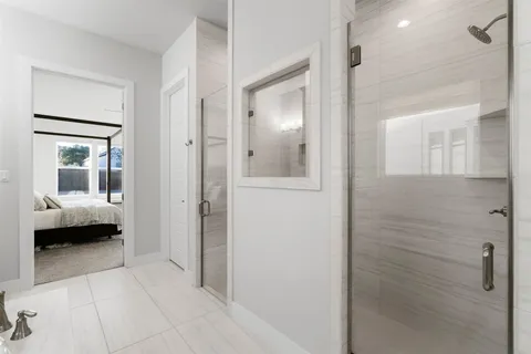 a bathroom with a tub and shower