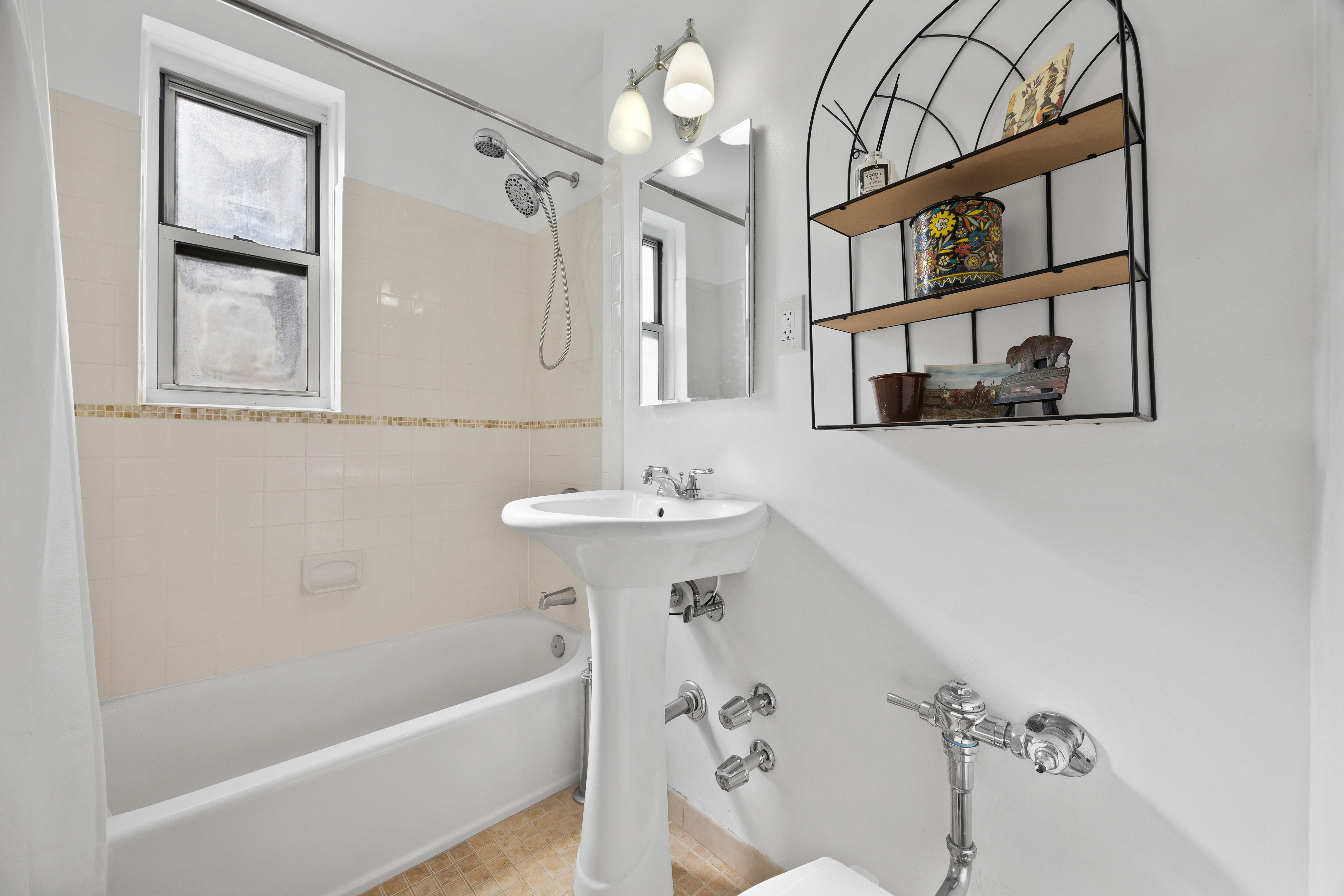 255 Fieldston Terrace, Unit 2L Bronx, NY 10471 - Photo 16 of 32 a bathroom with a sink a bathtub and a shower