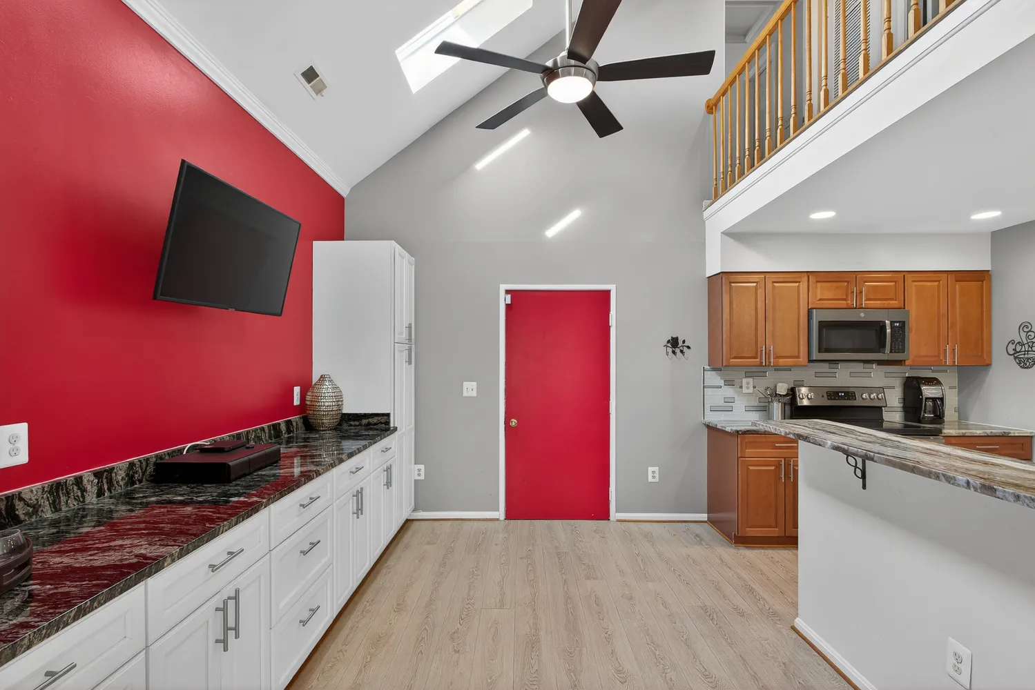 a kitchen with stainless steel appliances kitchen island granite countertop a stove a sink and a refrigerator