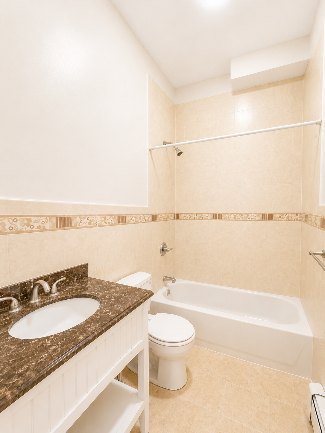 37-15 Broadway, Unit 2 Queens, NY 11103 - Photo 7 of 7 a bathroom with a granite countertop sink and a mirror