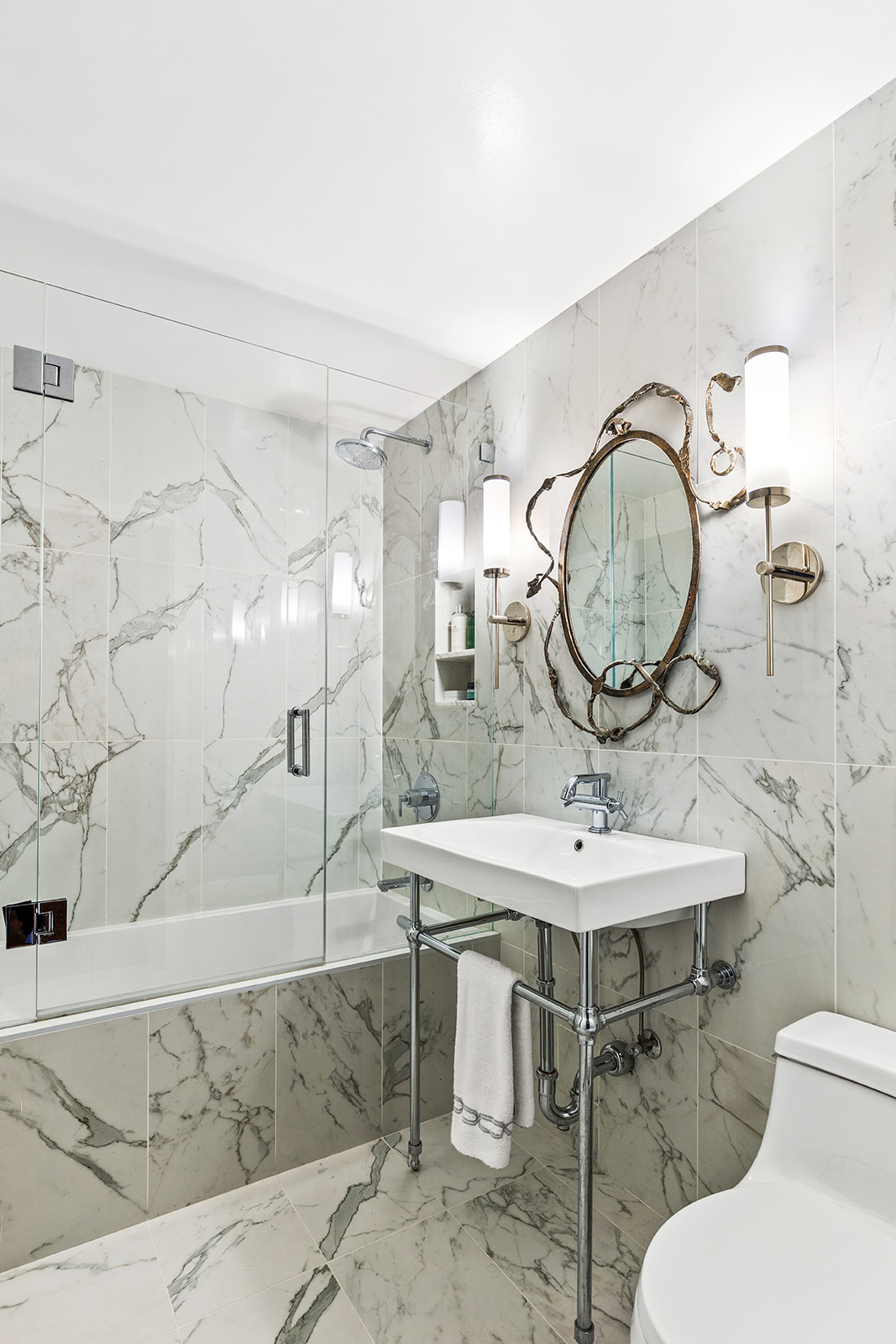 37 West 12th Street, Unit 6G Manhattan, NY 10011 - Photo 13 of 17 a bathroom with a sink and a mirror