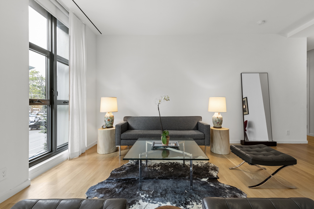 11 North Moore Street, Unit 2B Manhattan, NY 10013 - Photo 4 of 12 a living room with furniture and a window