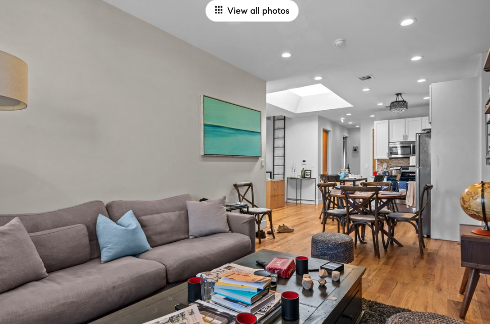 251 Troy Avenue Brooklyn, NY 11213 - Photo 2 of 9 a living room with furniture kitchen view and a wooden floor