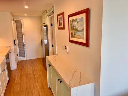 a kitchen that has a sink and a stove in it