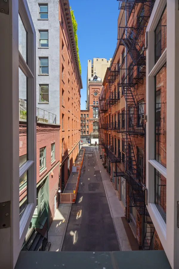 a view of buildings with wooden floor