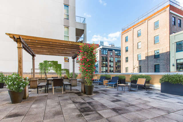 55 Berry Street, Unit 4B Brooklyn, NY 11249 - Photo 10 of 12 a front view of building with outdoor seating