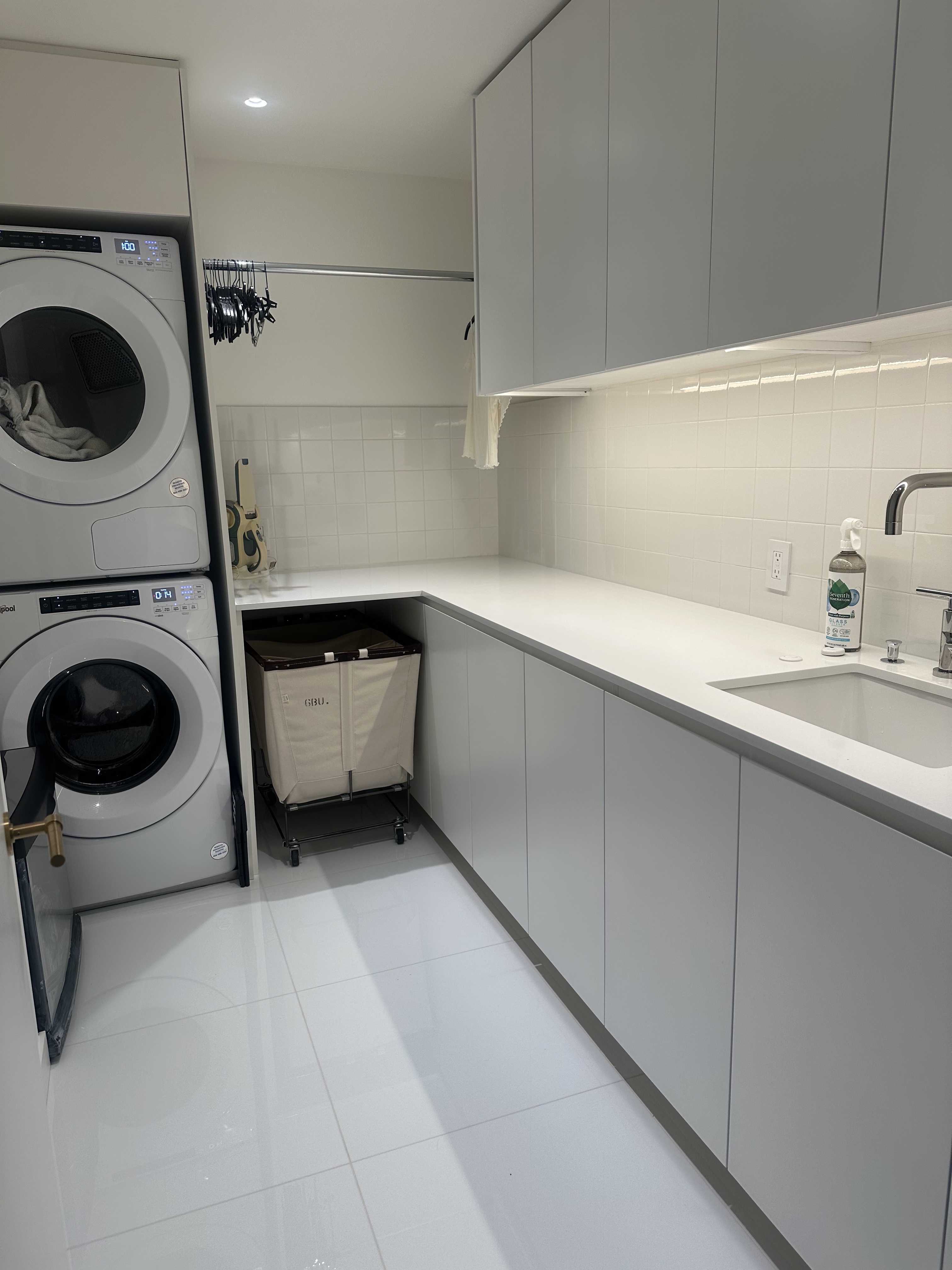 900 Park Avenue, Unit 7ABCE Manhattan, NY 10075 - Photo 17 of 18 a utility room with sink washer and dryer