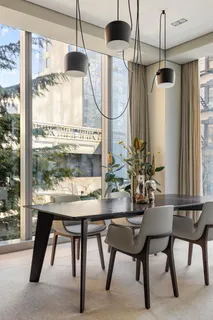 a dining room with furniture and window