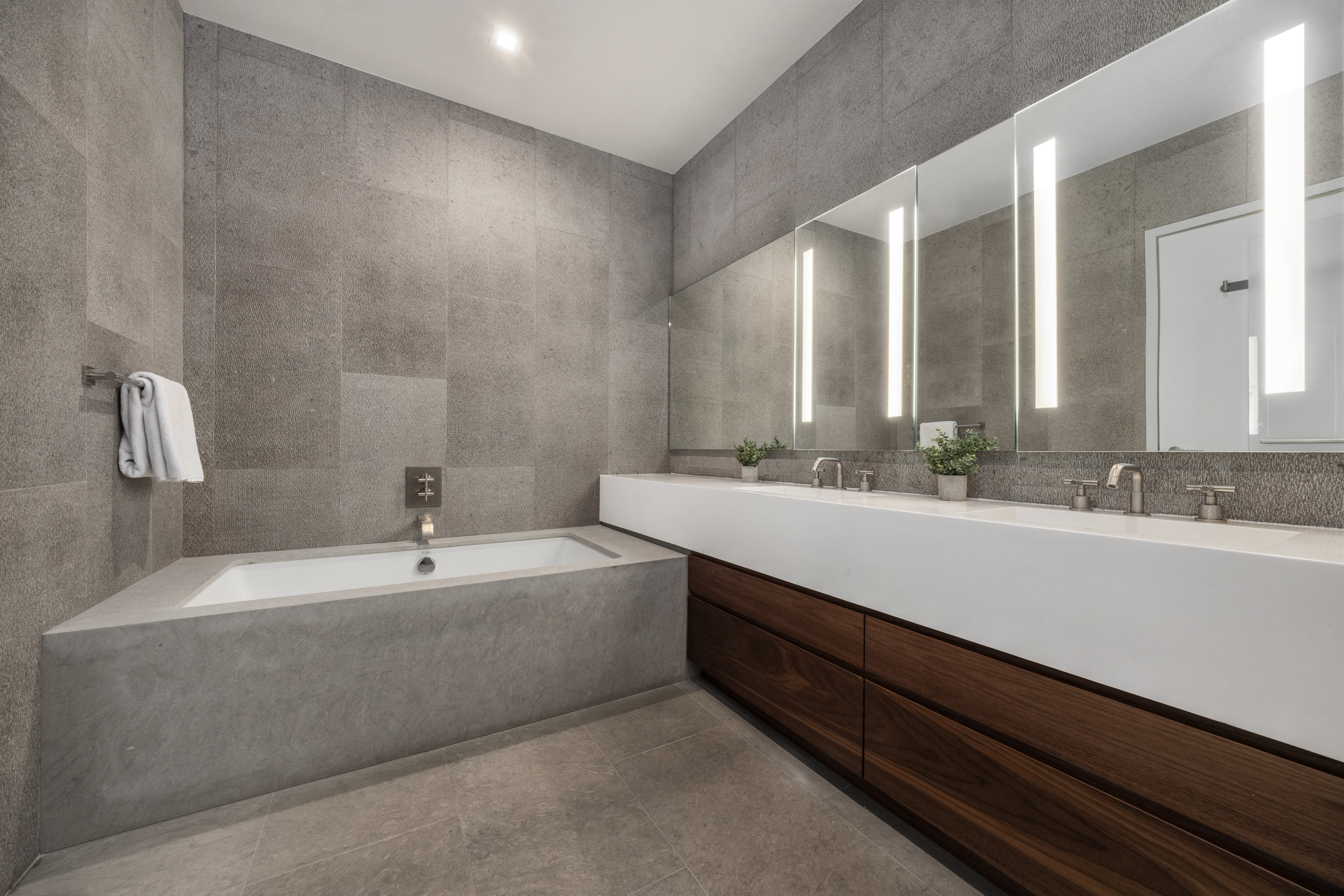 360 East 89th Street, Unit 29B Manhattan, NY 10128 - Photo 9 of 22 a bathroom with a double vanity sink and a mirror