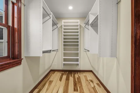 a view of entryway with wooden floor and stairs