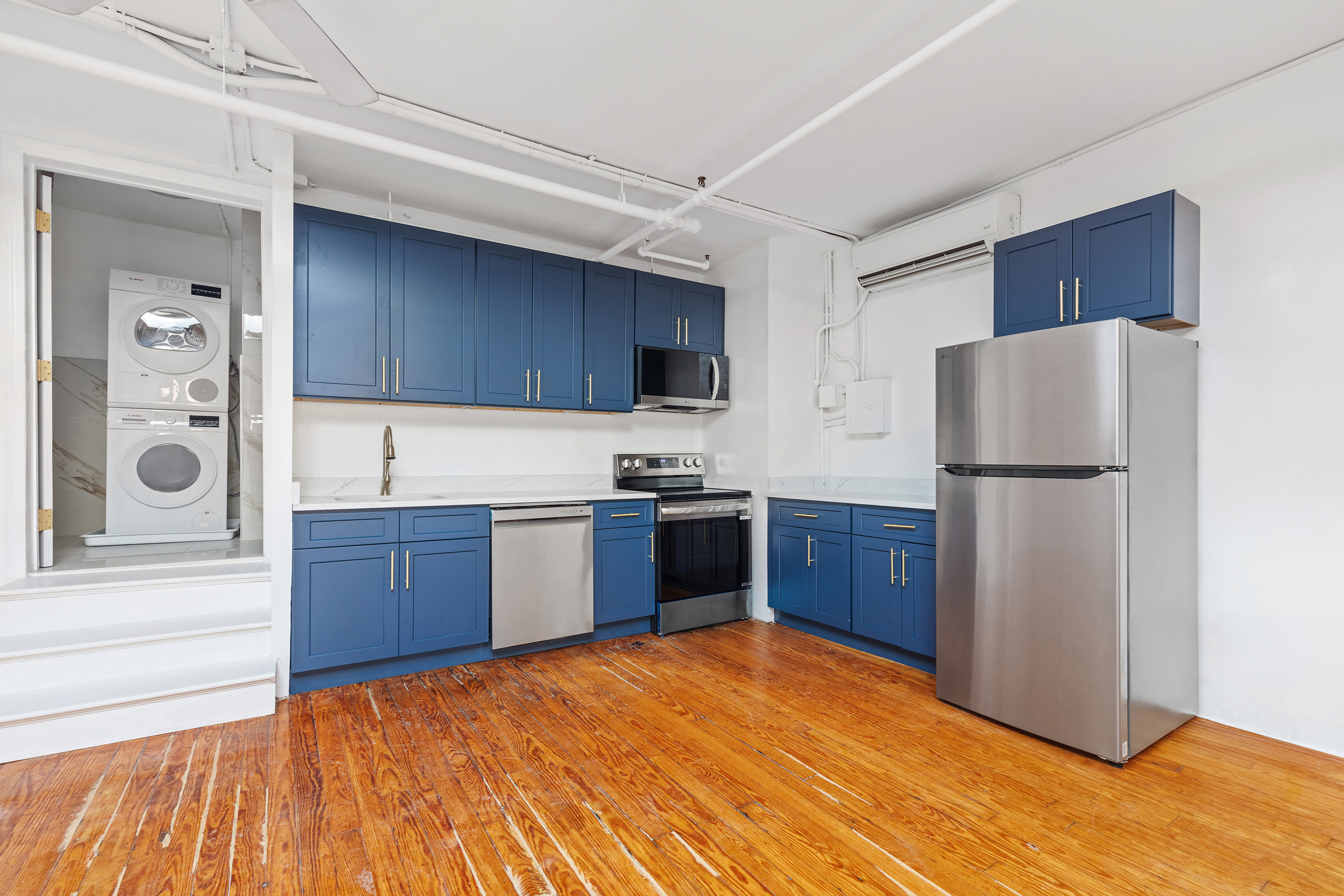 71 8th Avenue, Unit 4R Manhattan, NY 10014 - Photo 2 of 5 a kitchen with stainless steel appliances granite countertop a refrigerator stove a sink dishwasher and a refrigerator