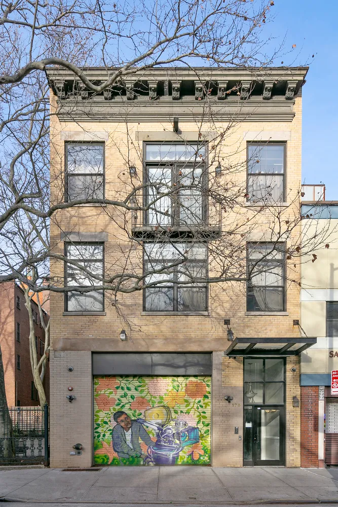 a view of a fireplace with two windows