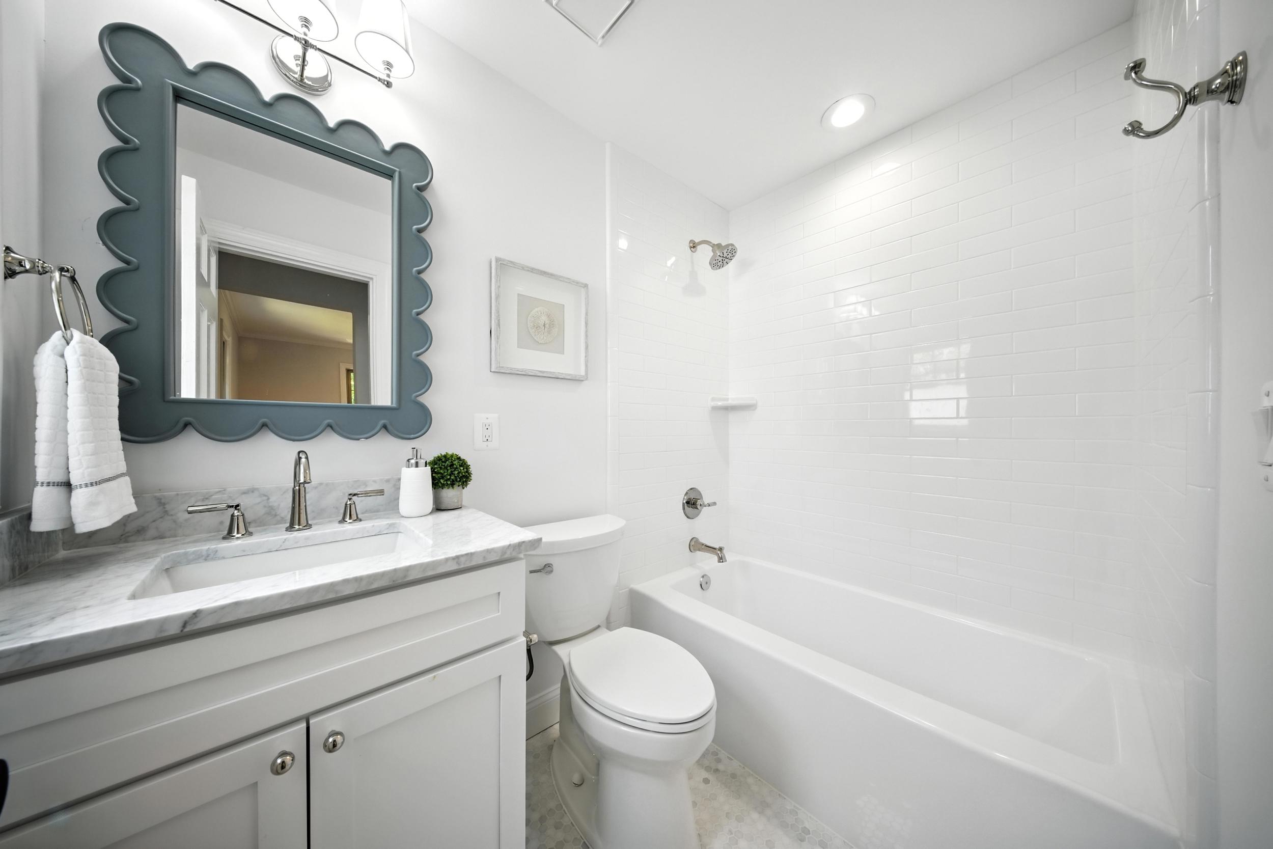 4505 Park Road Alexandria, VA 22312 - Photo 35 of 80 a bathroom with a granite countertop toilet sink and mirror