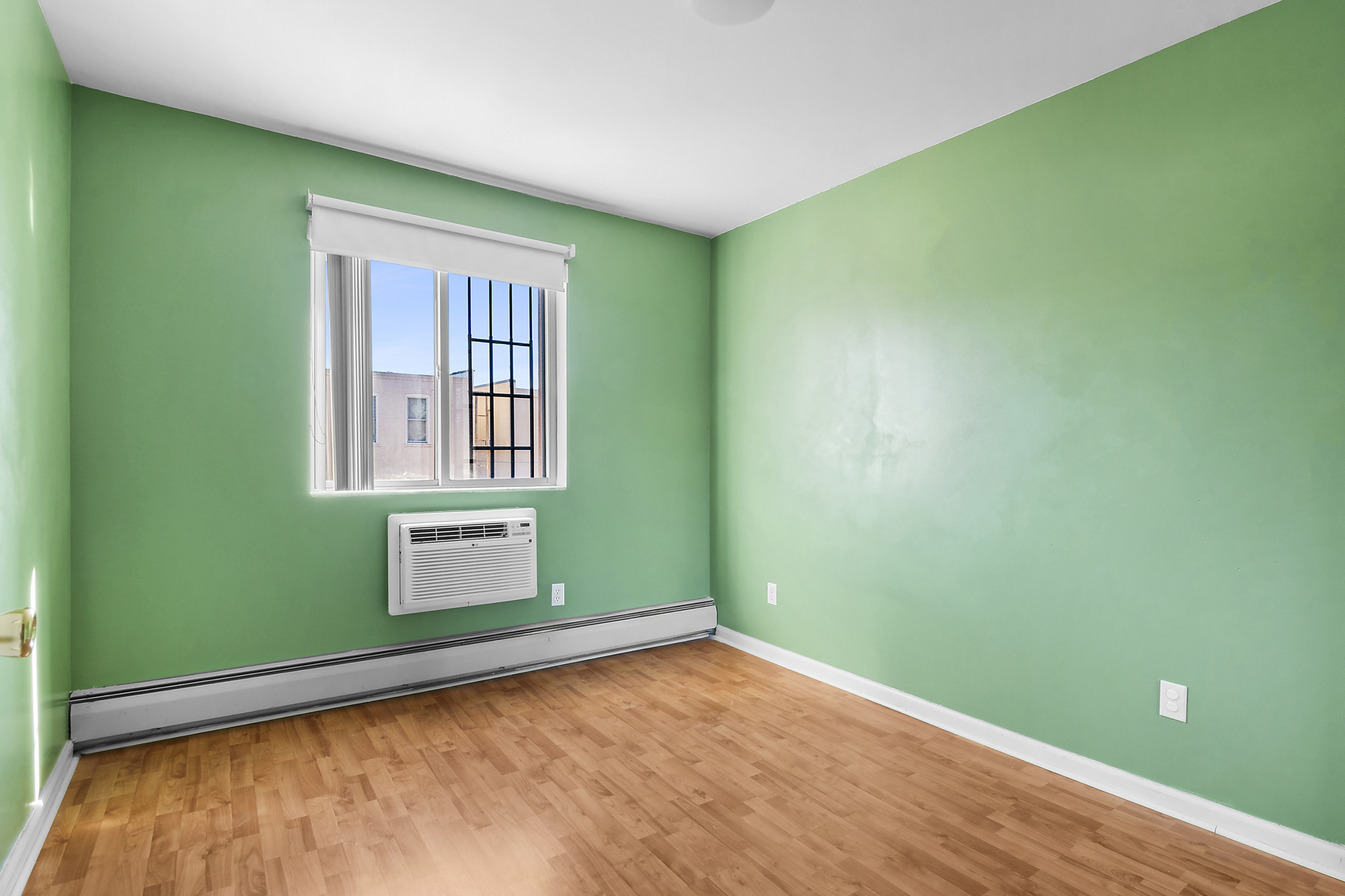 21-08 Butler Avenue, Unit J2 Queens, NY 11385 - Photo 11 of 14 a view of empty room with window