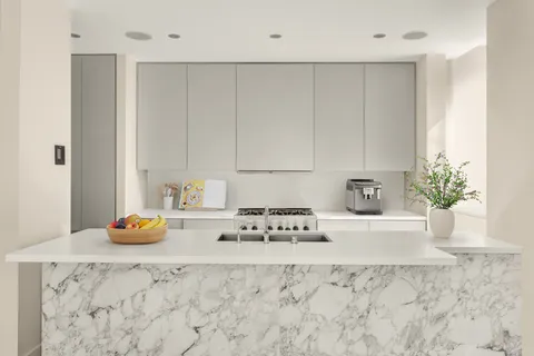 a kitchen with stainless steel appliances granite countertop a sink a stove and a wooden cabinets