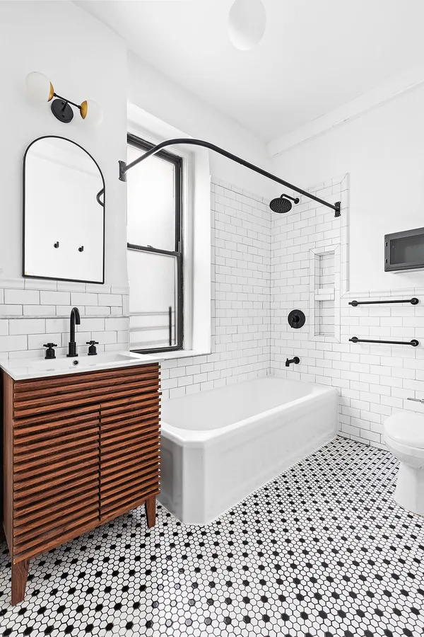 a bathroom with a sink a toilet and a bathtub