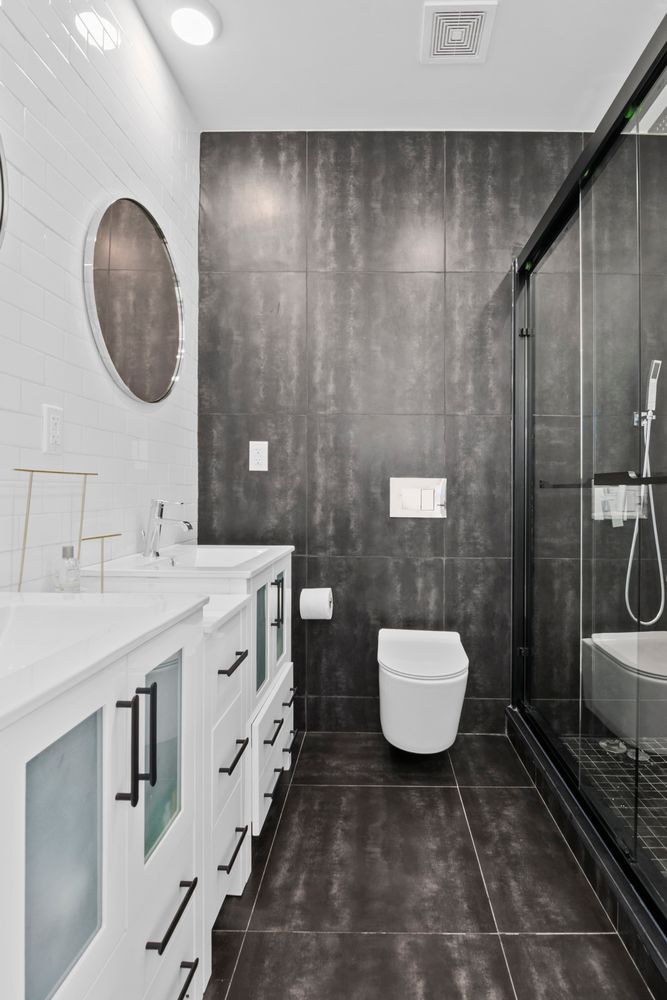 296 Fenimore Street Brooklyn, NY 11225 - Photo 15 of 19 a bathroom with a sink a toilet and mirror