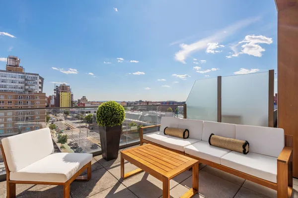 a living room with furniture and a piano