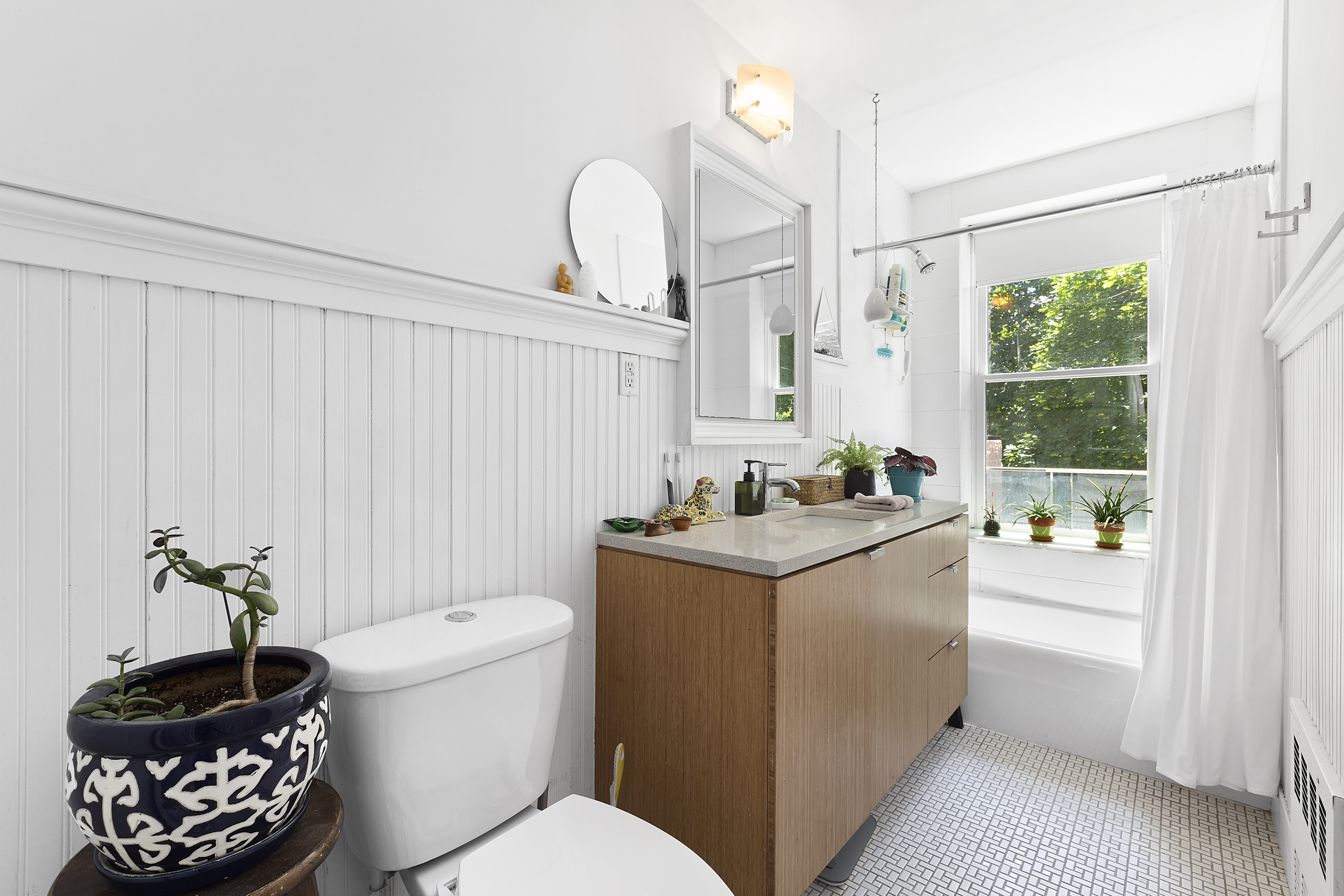 64 Clifton Place Brooklyn, NY 11238 - Photo 18 of 22 a bathroom with a sink a toilet and tub