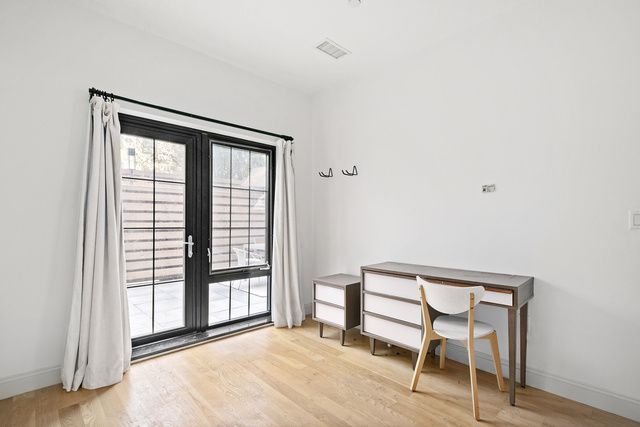 42 Maspeth Avenue, Unit 1D Brooklyn, NY 11211 - Photo 7 of 28 a view of a room with a window and wooden floor