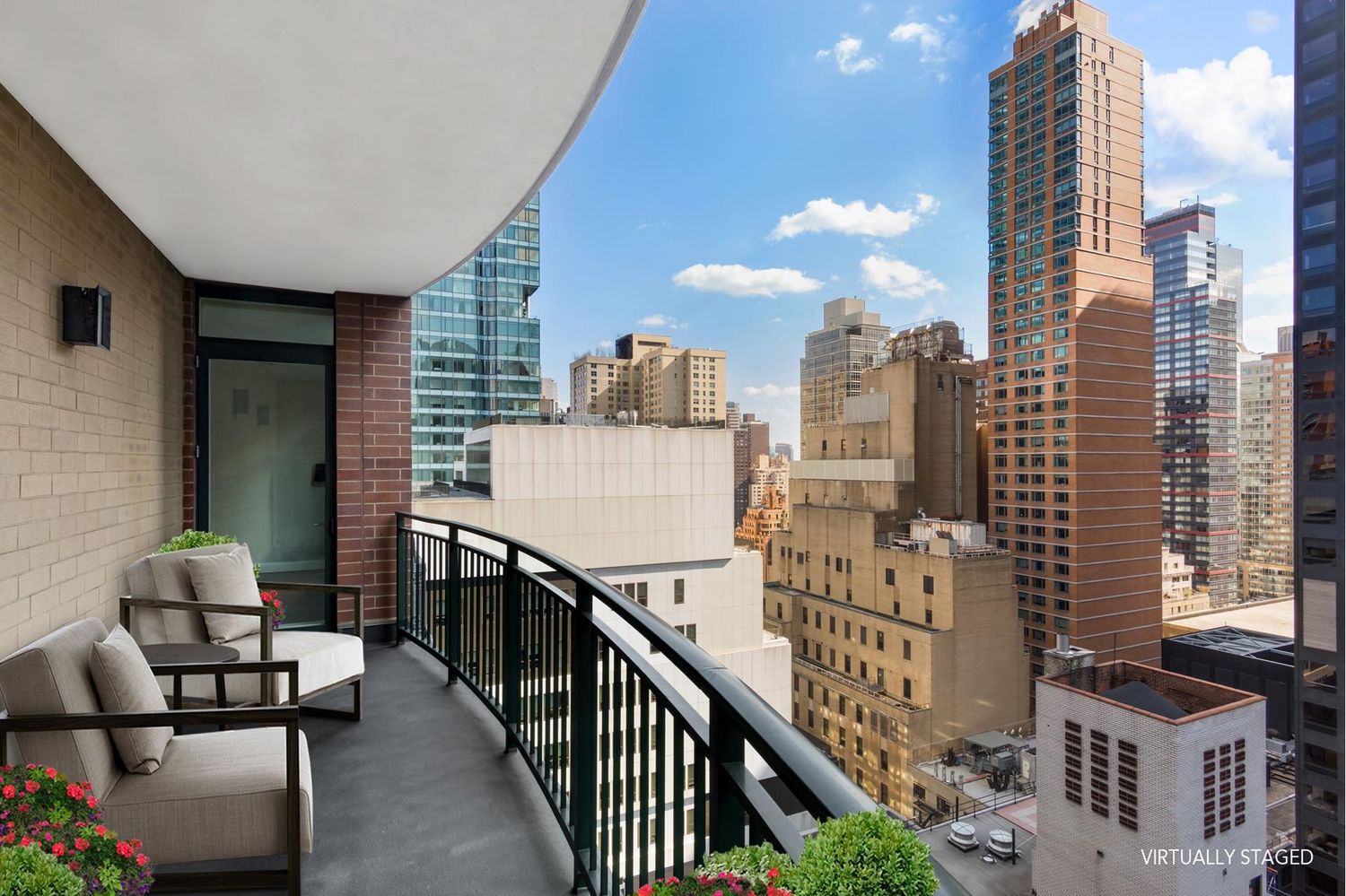 212 East 57th Street, Unit 18A Manhattan, NY 10022 - Photo 4 of 14 a view of balcony with couch