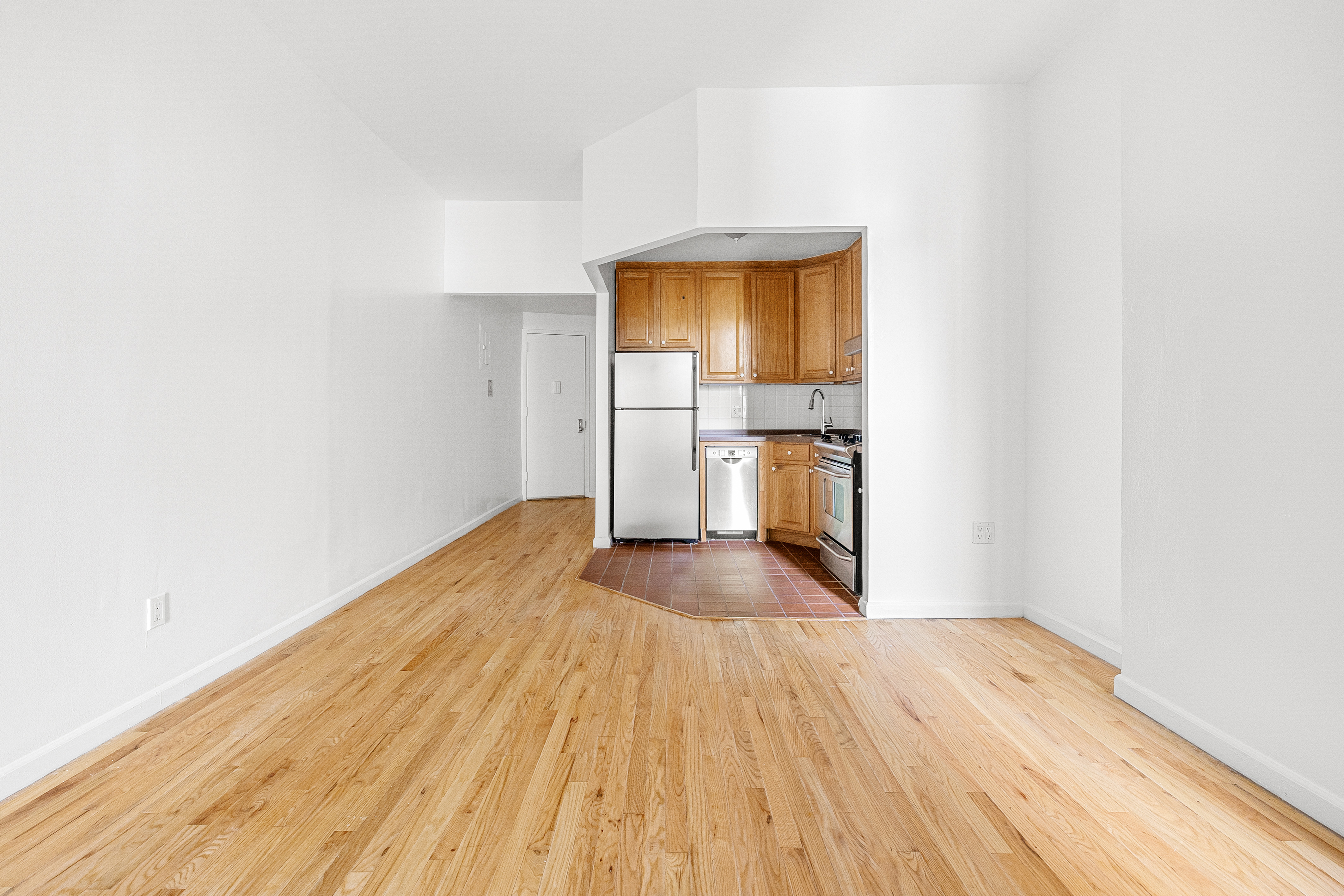 325 3rd Street, Unit 2A Brooklyn, NY 11215 - Photo 6 of 13 a view of empty room with wooden floor and fan