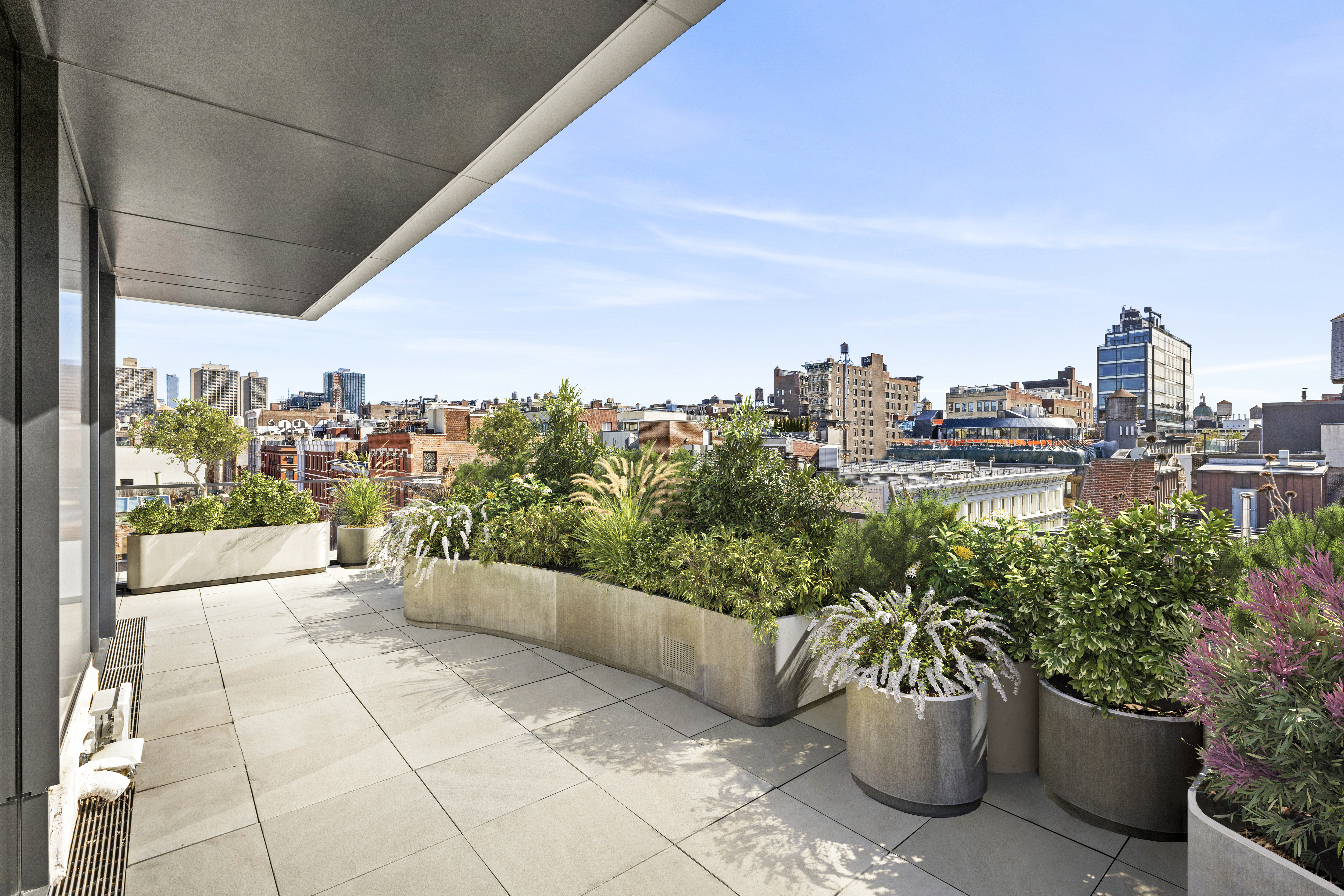 27 Wooster Street, Unit PH Manhattan, NY 10013 - Photo 6 of 34 a view of a terrace with chairs and potted plants