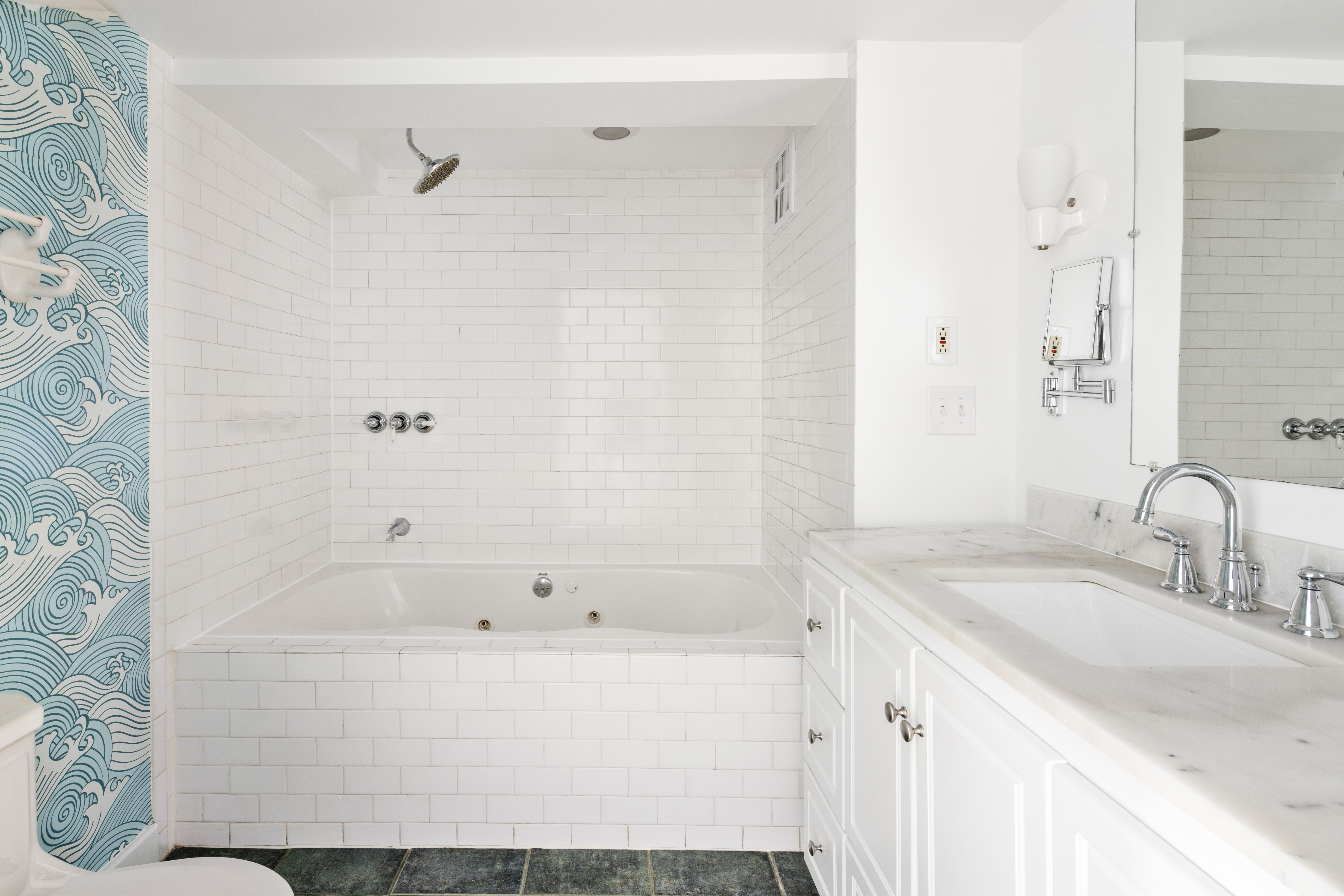 61 Norman Avenue Brooklyn, NY 11222 - Photo 18 of 22 a bathroom with a bathtub and a sink