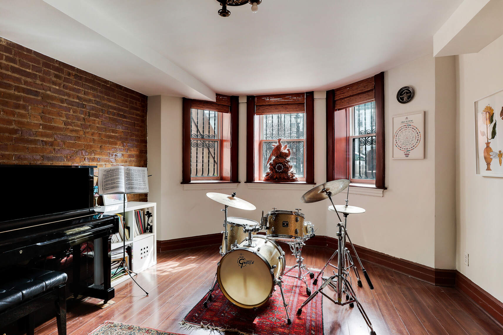 261 Fenimore Street Brooklyn, NY 11225 - Photo 16 of 21 a living room with furniture flat screen tv and a fireplace