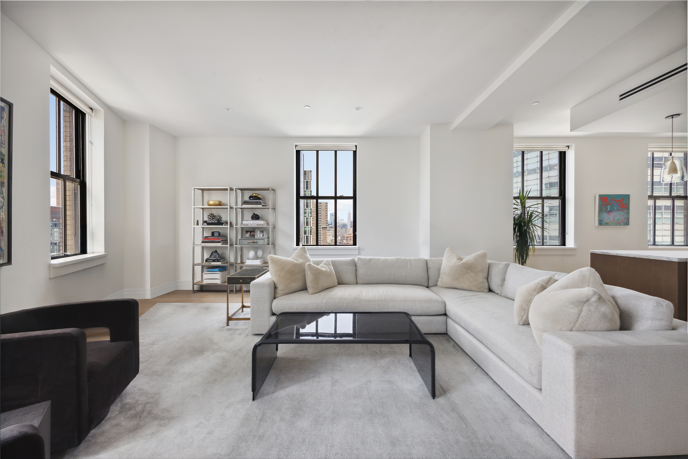 100 Barclay Street, Unit 15B Manhattan, NY 10007 - Photo 3 of 16 a living room with furniture and a window