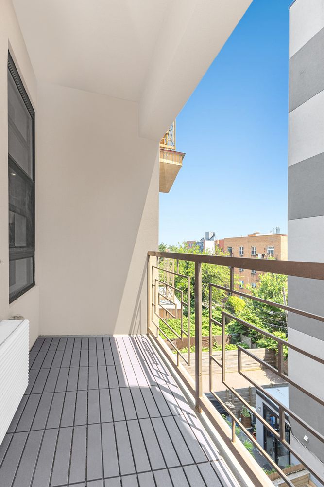 452 Lafayette Avenue, Unit 4B Brooklyn, NY 11205 - Photo 7 of 15 a view of a balcony with wooden floor
