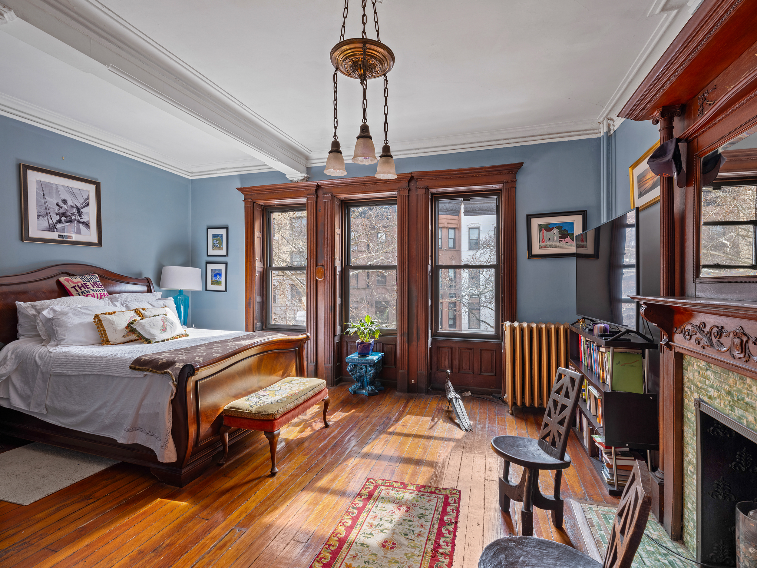 291 Sterling Place Brooklyn, NY 11238 - Photo 9 of 19 a bedroom with a bed wooden floor and windows