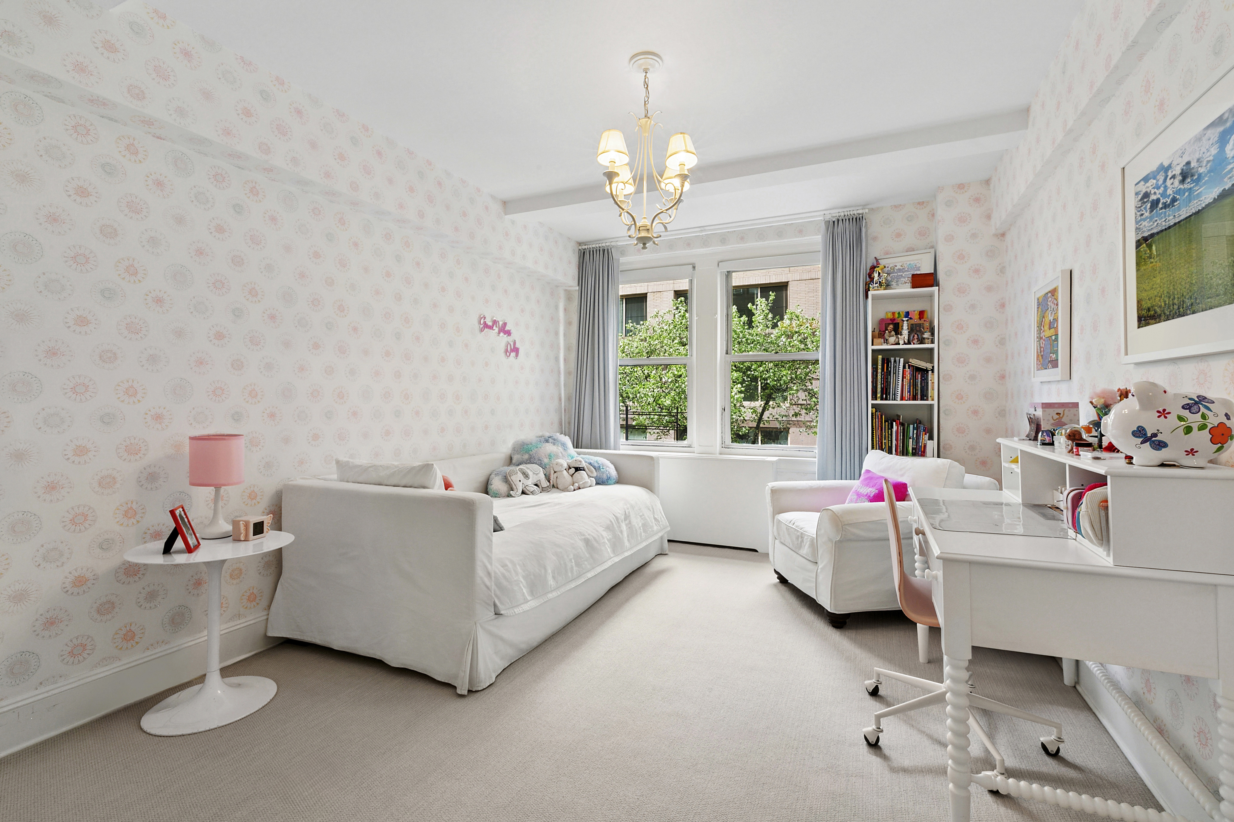 205 East 69th Street, Unit 3A Manhattan, NY 10021 - Photo 6 of 11 a bed room with a bed and a flat screen tv