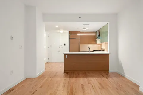 a view of kitchen with wooden floor