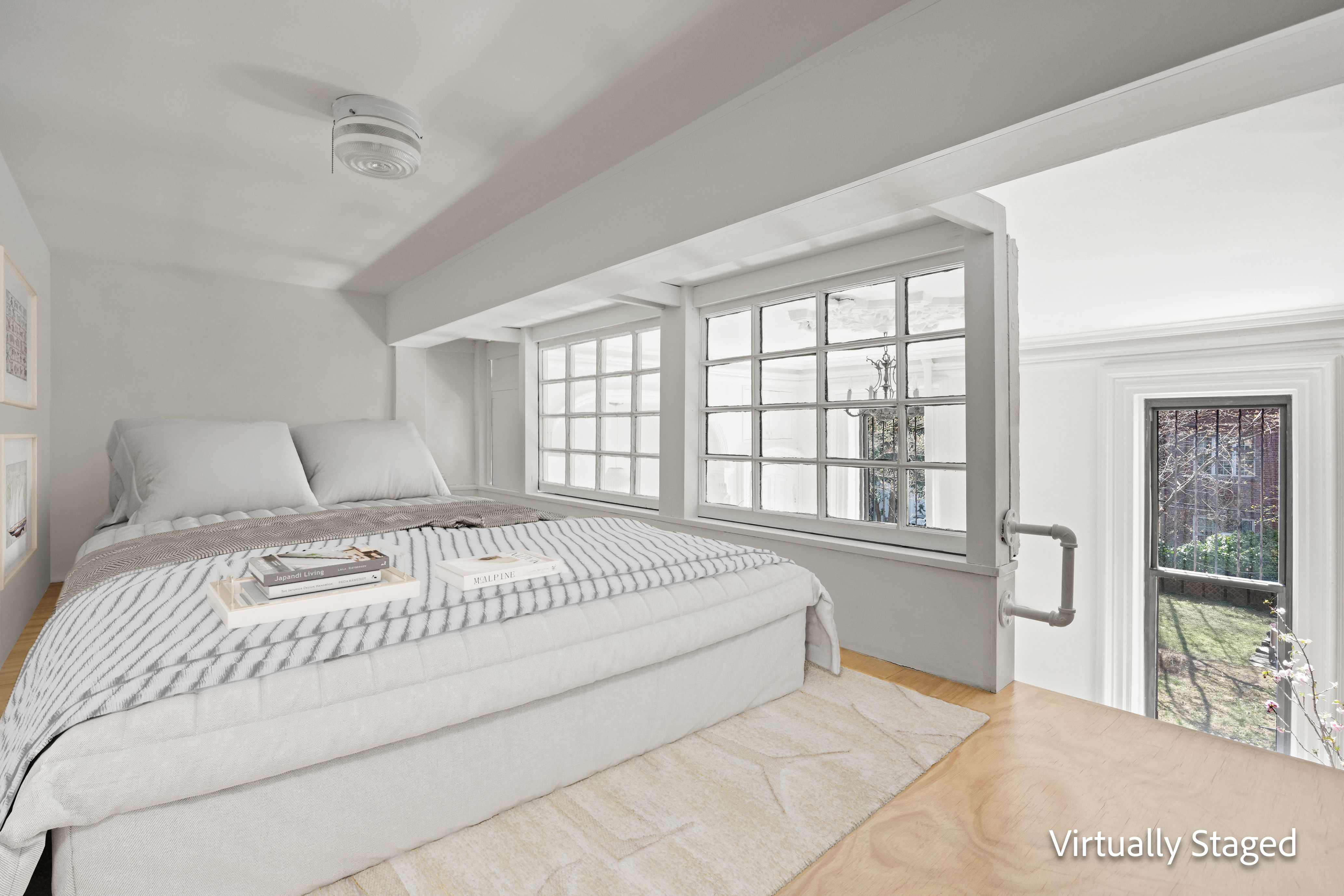 144 Park Place, Unit 3 Brooklyn, NY 11217 - Photo 4 of 6 a spacious bedroom with a large bed and a large window